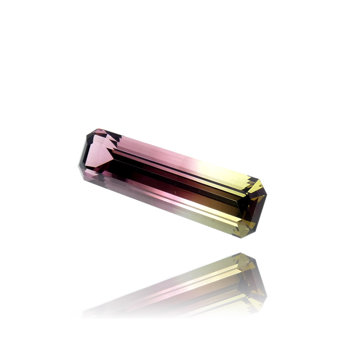 Rare long rectangular 12.02ct Bi-Color Tourmaline. Gemstone gradates from dark red to sherry, yellow to dark green. Item #CCJ-BIT-301.