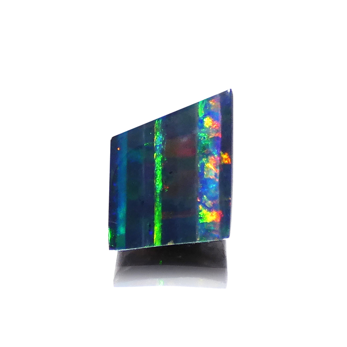 Impressive 4.33ct modified square cut Australian Boulder Opal displays thin-to-wide vertical bands of broad flash. Item #CCJ-BO-625.