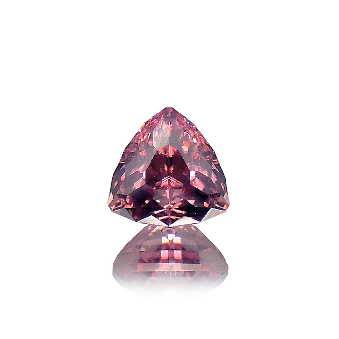 Simply perfection, this 6.06ct super trillion Sherry Zircon is cut by award-winning John Dyer. Item #CCJ-ZS-300.