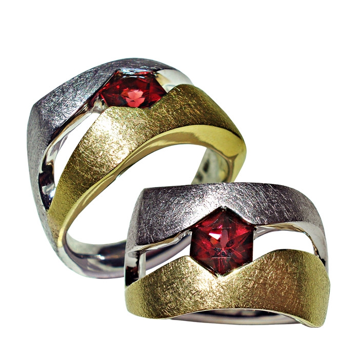 Heartlock Item# CRG-RYW-G-1149 Stone: Garnet = 1.30 cts Setting: 18KYG / 14KWG = 13.9 dwt Designer Remarks: Partial Bezel Gent’s Ring