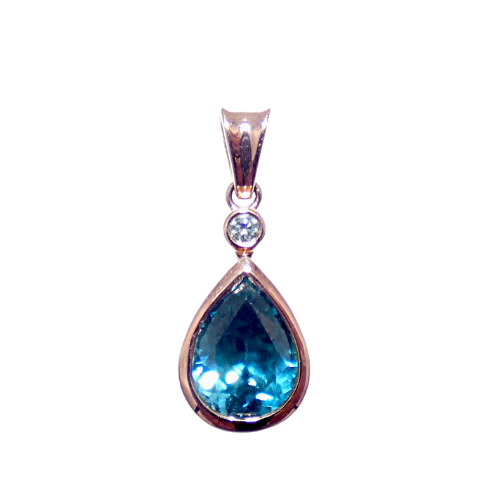 Ladies pendant with pear-shaped blue zircon = 2.98 cts and round diamond = .08 cts SI-1 G in 18KRG = 2.32 grams. Item# PR-BZ-D-2427