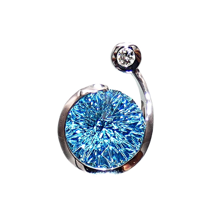 Stone: blue topaz = 10.1 cts; round diamond = .14 cts Setting: 14KWG = 8.3 grams Item # KPW-BT-D-2479 Remarks: KC one-of-a-kind ladies pendant with a stunning blue zircon by world-renown gem cutter, John Dyer.